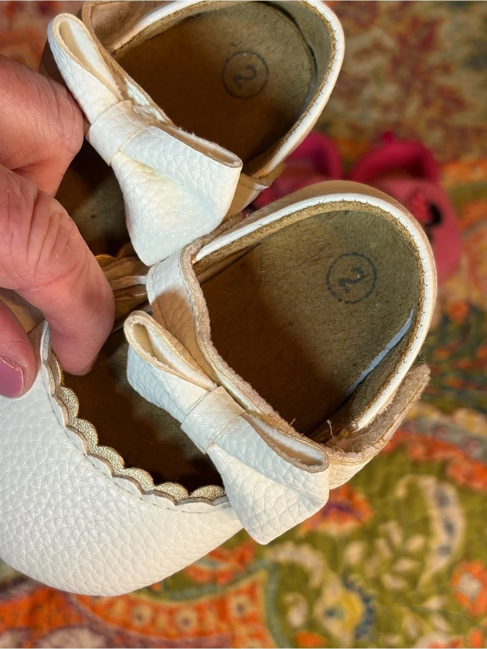 Lot of three pairs of Baby shoes.